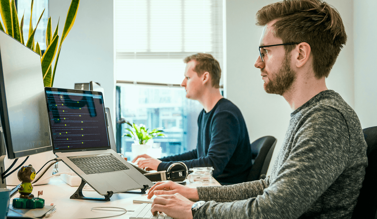 developers sitting at workstations in an office