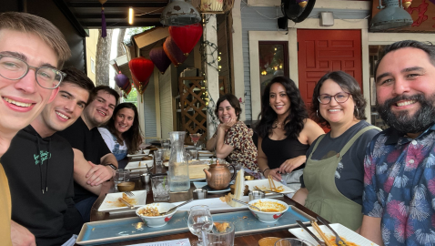 group of Coder employees sitting at a table